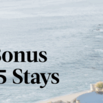 a beach with a pool and a building