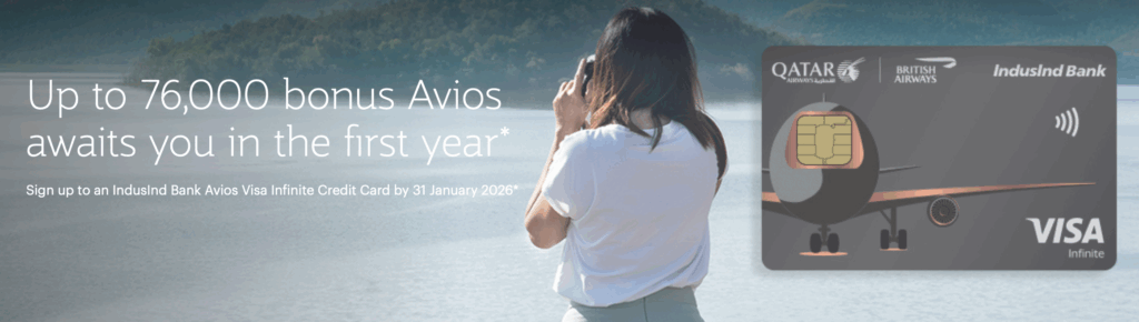A woman is standing by a body of water, taking a photo with a camera. The background features a scenic view of water and trees. Overlaid text reads, "Up to 76,000 bonus Avios awaits you in the first year*." Below, it says, "Sign up to an IndusInd Bank Avios Visa Infinite Credit Card by 31 January 2026*." On the right, there is an image of a credit card with logos of Qatar Airways, British Airways, and IndusInd Bank, along with the Visa Infinite logo.