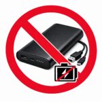 The image shows a black power bank with a USB cable, overlaid with a red prohibition symbol. There is also a crossed-out battery icon, indicating a restriction or ban on using the power bank.