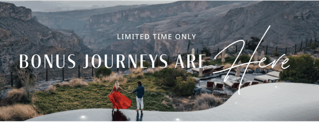 A couple is standing on the edge of an infinity pool, holding hands and looking at a scenic view of a canyon. The woman is wearing a flowing red dress, and the man is in a blue jacket and white pants. There are lounge chairs and umbrellas nearby. The text on the image reads "Limited Time Only Bonus Journeys Are Here."