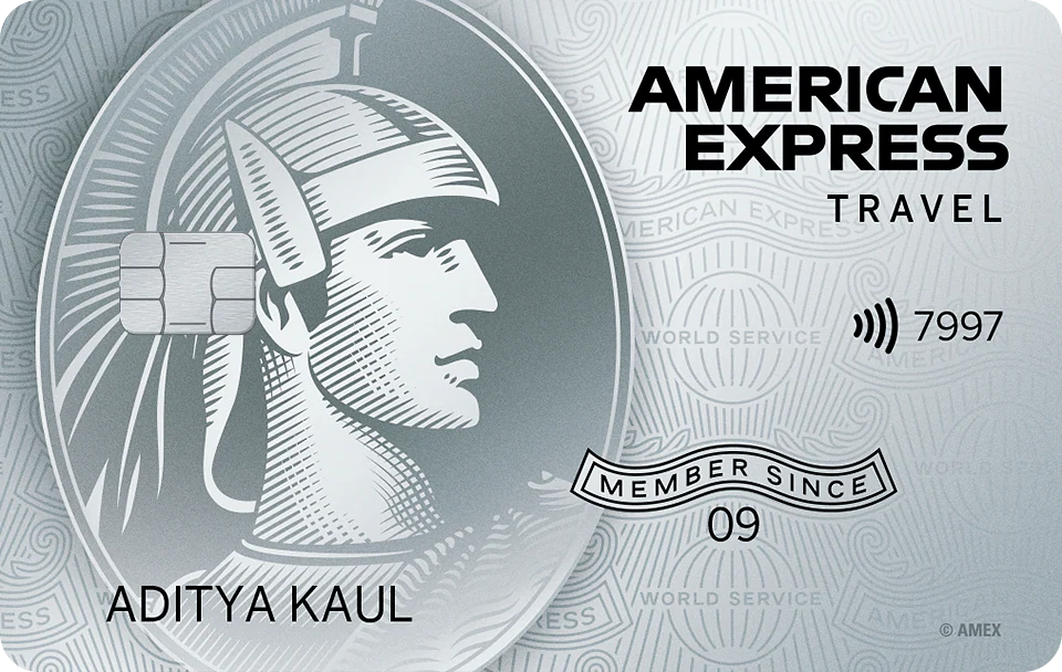 This image shows an American Express credit card. It features a stylized profile of a centurion in a helmet on the left side. The card has a chip and contactless symbol, with the words "AMERICAN EXPRESS TRAVEL" on the right. The name "ADITYA KAUL" is printed at the bottom left, and "MEMBER SINCE 09" is displayed in a banner. The background has a pattern with the words "WORLD SERVICE."