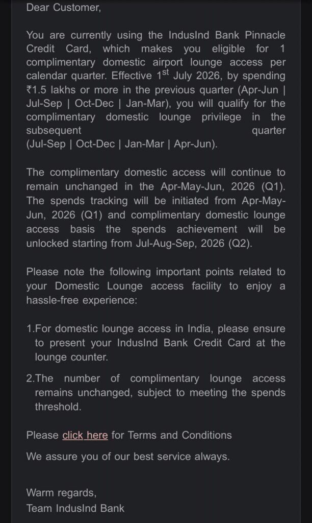 The image is a notification from IndusInd Bank regarding the Pinnacle Credit Card. It informs the customer about eligibility for complimentary domestic airport lounge access per calendar quarter, effective from July 1, 2026. To qualify, a customer must spend ₹1.5 lakhs or more in the previous quarter. The complimentary access remains unchanged for April-May-June 2026, with spend tracking starting from that period. It also provides instructions for accessing the lounge and mentions that the number of complimentary accesses remains unchanged if the spending threshold is met. There is a link for terms and conditions, and the message is signed by Team IndusInd Bank.