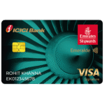 This image shows a credit card from ICICI Bank, co-branded with Emirates Skywards. The card is labeled "Emeralde" and features a Visa Signature logo. It has a teal design with a chip on the left side. The name "Rohit Khanna" and a card number are printed on the bottom left.