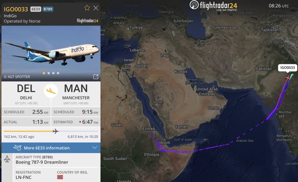 The image shows a flight tracking map from Flightradar24. It displays the route of IndiGo flight IGO0033, operated by Norse, from Delhi (DEL) to Manchester (MAN). The flight is a Boeing 787-9 Dreamliner with registration LN-FNC. The map shows the flight path over the Arabian Sea and parts of the Middle East. The left side of the image includes flight details such as scheduled and actual departure times, estimated arrival time, and distance. A photo of the aircraft is also shown.