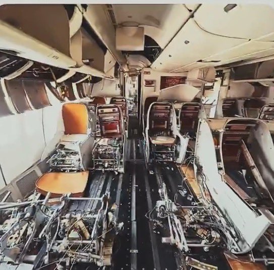inside a plane with many seats