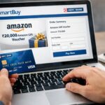 a person holding a credit card and typing on a laptop